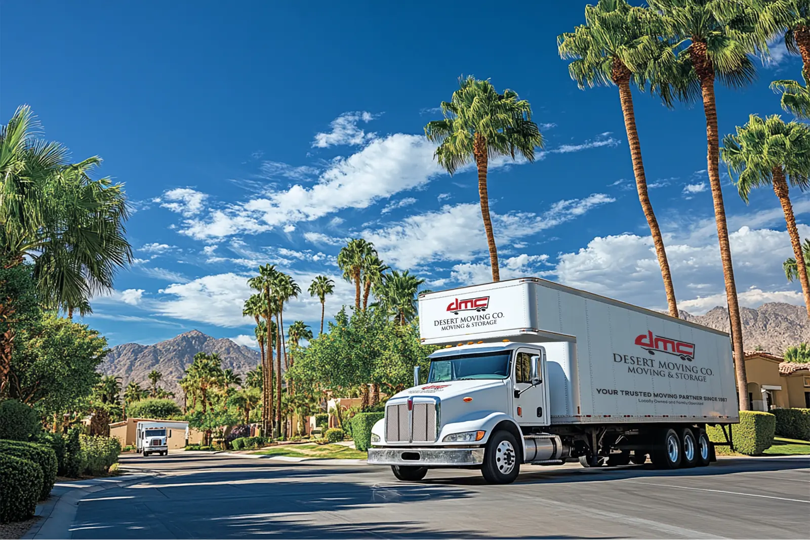 A Desert Moving truck driving down a palm-lined street